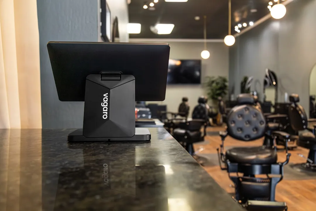 A vagaro pos system on a counter in a barbershop